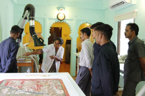 Attendants being introduced to the equipments in the conservation laboratory by the conservator